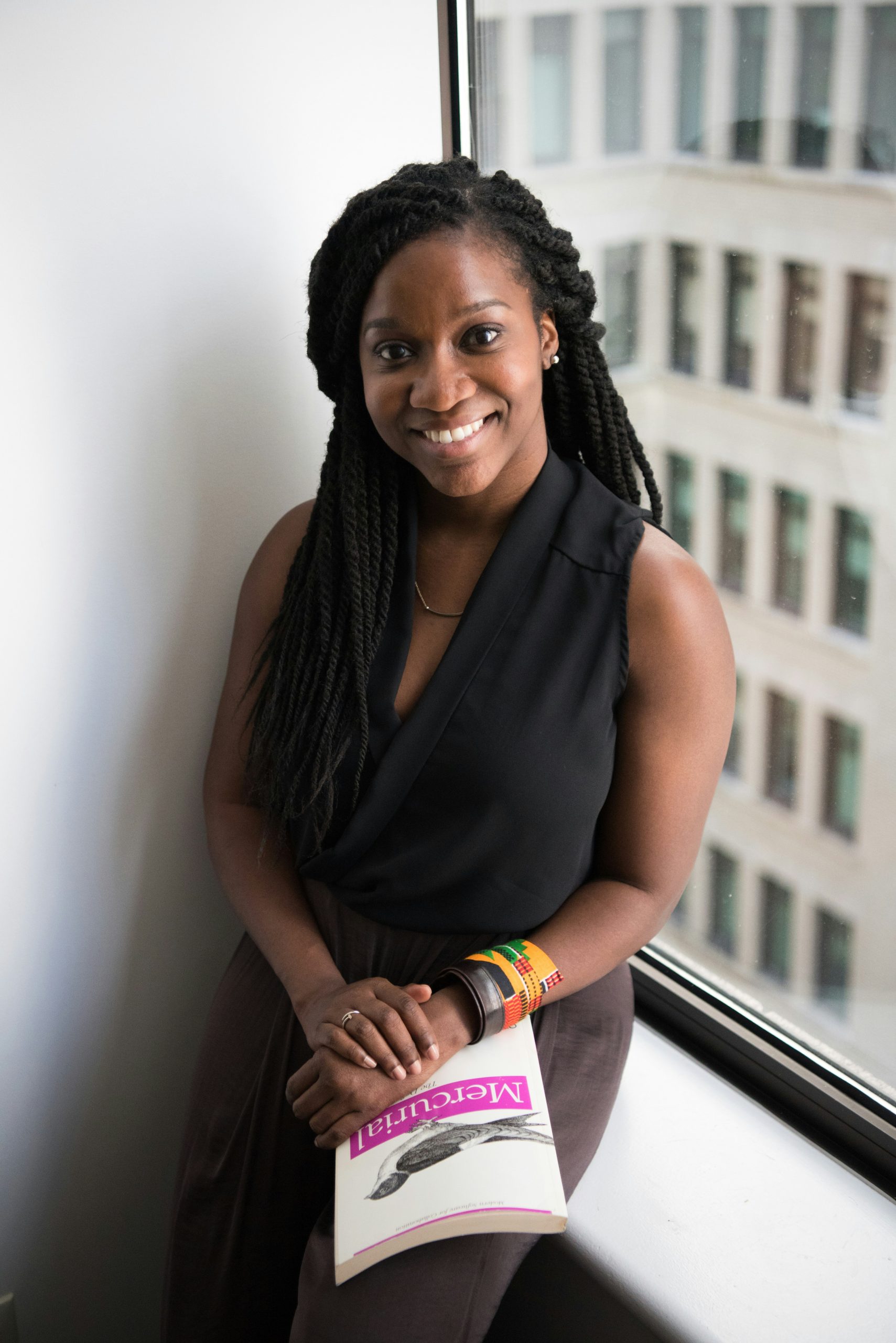 Stock image of a Black woman smiling for review